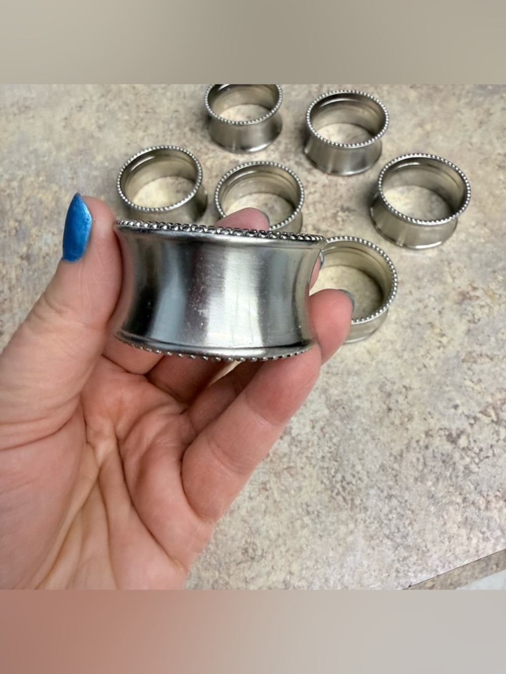 Set of 8 silver tone napkin rings